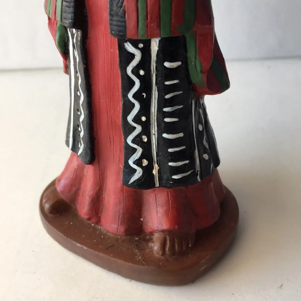 Man in African Tribal Wear Playing Drum Figurine